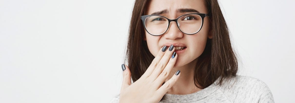 woman-covering-mouth