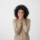 close-up-portrait-of-upset-scared-black-woman-covering-her-mouth-with-both-palms-to-prevent-screaming-sound-after-seeing-or-hearing-something-bad-negative-emotions-facial-expressions-and-feelings