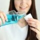 young-girl-uses-mouthwash-at-home-close-up